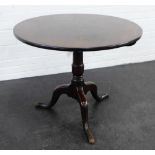 Georgian mahogany tea table, the circular top on a baluster column and tripod legs, 70 x 84cm