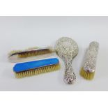 Silver backed hand mirror and two silver backed clothes brushes together with an Epns and enamel