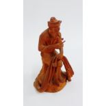 Terracotta figure of a Fisherman mending nets, 13cm high