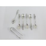 Set of six continental silver teaspoons and matching sugar tongs (7)