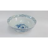 Chinese blue and white bowl with stylised border and landscape pattern to the well, on a circular