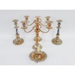 Pair of silver plate on copper candelabra, together with a pair of Rococo style candlesticks and a