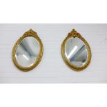 Pair of oval giltwood framed wall mirrors, 78 x 50cm (2)