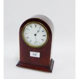 Mahogany and inlaid mantle clock, the enamel dial with Roman numerals on four brass bun feet, 21.5cm