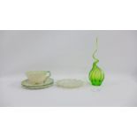 Collection of porcelain to include a shell moulded cup, three saucers, a leaf shaped dish and