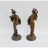 Pair of French bronze patinated Spelter female figures on circular hardstone bases, 35cm high, (2)