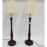 Pair of wooden table lamp bases with pleated shades, 73cm high overall, (2)