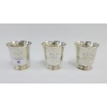 Three Sterling silver beakers, 8cm high (3)