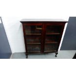 Mahogany glazed bookcase with claw and ball feet, 126 x 115cm