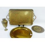 Three Eastern brass trays and an Indian style brass vase (4)