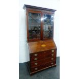 Georgian mahogany and inlaid bureau bookcase, the dentil cornice top over a pair of astragal