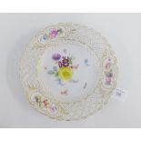 Meissen porcelain plate with gilt edged rim and pierced border, with hand painted floral sprays with