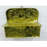 Brass wall box with Lion rampant's, flowers and Dutch figure embossed pattern, with hinged lift up
