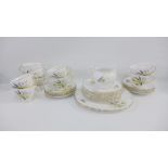 Colclough bone china teaset comprising nine cups, ten saucers, ten side plates, cream jug and two