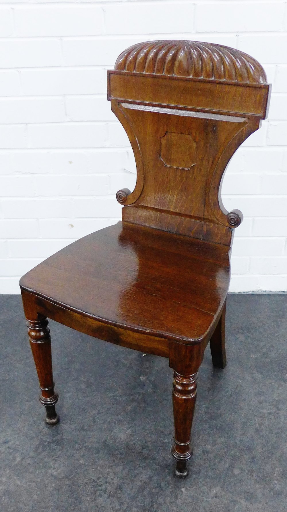 Oak hall chair, with carved top rail, solid seat and turned supports, 88 x 44cm