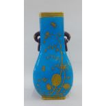Minton's porcelain vase with gilt bamboo and butterfly pattern to a turquoise ground, with twin