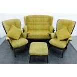 Ercol stick back lounge suite comprising a two seater settee, two armchairs and a footstool, largest