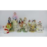 Collection of Staffordshire figures, other flatbacks, and spill vases together with a Spaniel,