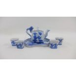 Miniature Japanese blue and white Saki set comprising an oval tray teapot and four cups