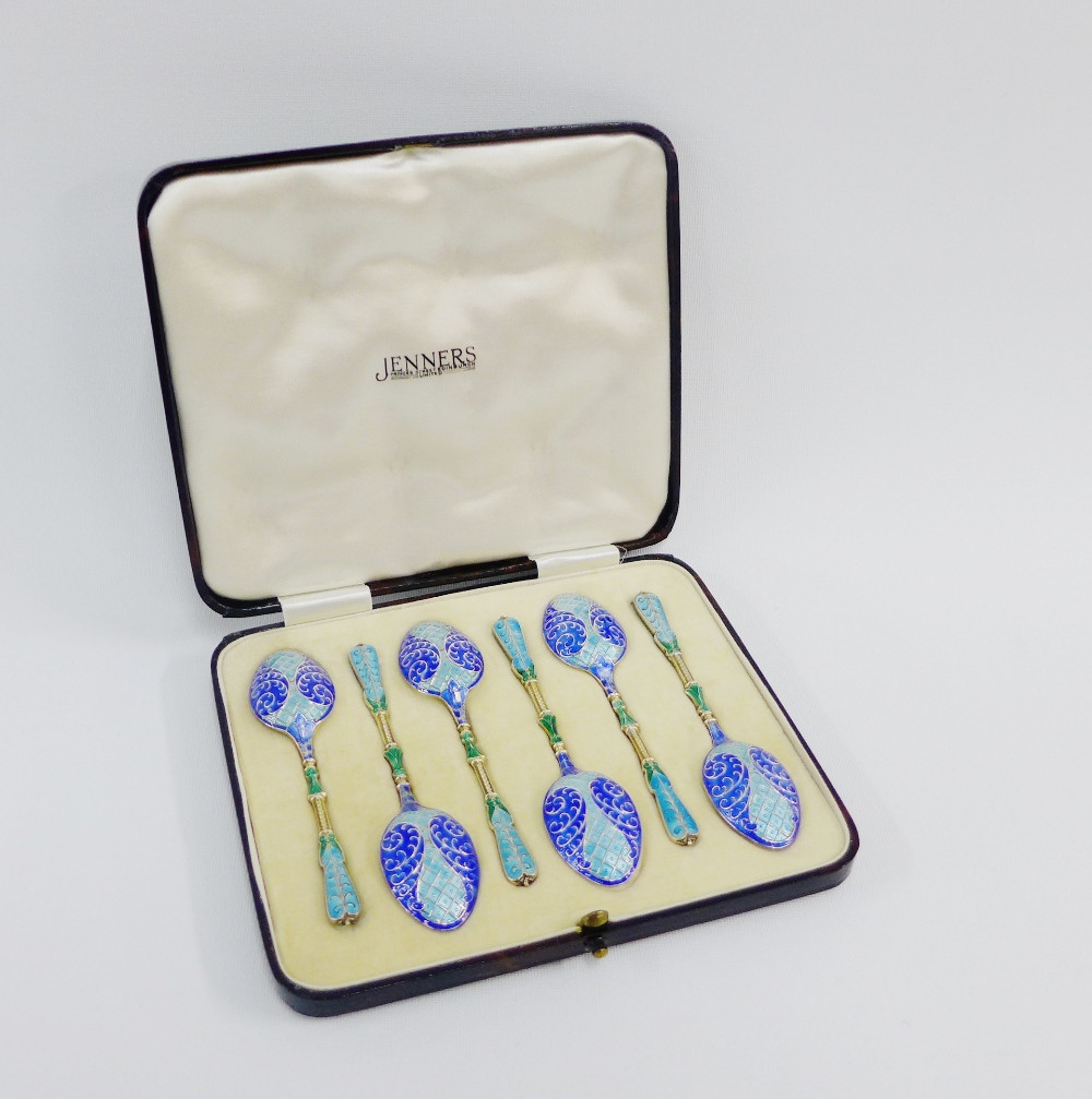 A cased set of six enamel and silver gilt teaspoons by Turner & Simpson, each elaborately