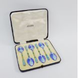 A cased set of six enamel and silver gilt teaspoons by Turner & Simpson, each elaborately