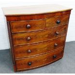 19th century mahogany bow front chest, with two short and three long drawers, flanked by spiral