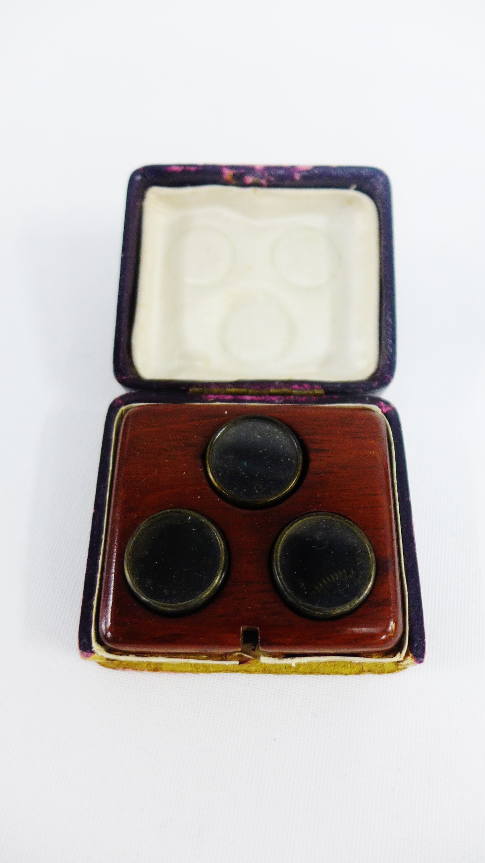 Set of three lenses contained within a small mahogany case