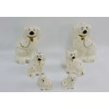 Six Beswick pottery white glazed chimney spaniels with gilt collars and chains, tallest 23cm, (6)