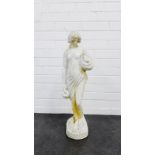 Figural stoneware garden ornament of a female water carrier , 74cm high
