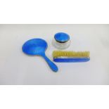 Birmingham silver and blue enamel backed hand mirror and clothes brush together with a similar