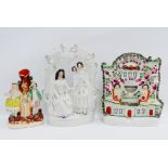 Staffordshire flatbacks to include 'Fortune Teller' pocket watch stand and a figural spill vase,