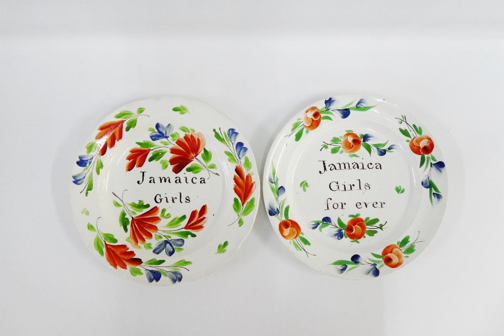 Two sponge ware plates inscribed 'Jamaica Girls' and Jamaica Girls Forever', 26cm diameter, (2)