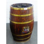 Oak and brass bound barrel with brass rims and Armorial pattern on front, 62 x 35cm