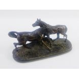 After P.J Mene, a bronze study of two horses, on an oval base with impressed signature, 13cm