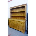 Pine dresser with a shelved back above four short drawers over three cupboards, 200 x 162cm