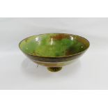 Sutton Taylor, porcelain footed bowl glazed in green and brown, with an impressed monogram, 20cm