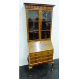 Mahogany and burrwood bureau bookcase, the cornice top with tear drop moulding over a pair of