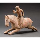 RUNNING HORSE WITH FEMALE POLO PLAYERTerracotta with remnants of original paintingChina, Tang