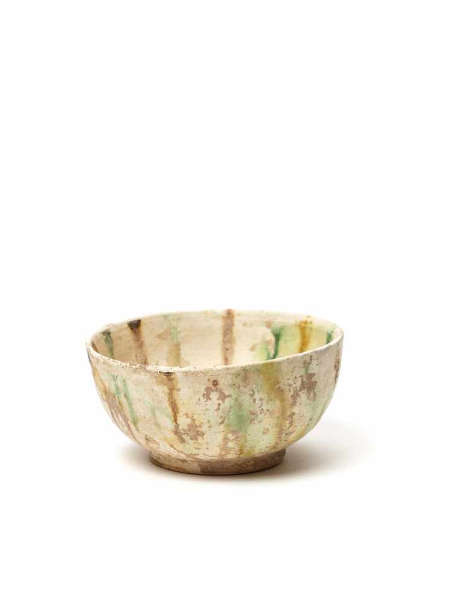 A RARE SANCAI ‘LACRIMA’ BOWL, TANG DYNASTYThe bowl with an unusual multicolored ‘tears’ glaze,