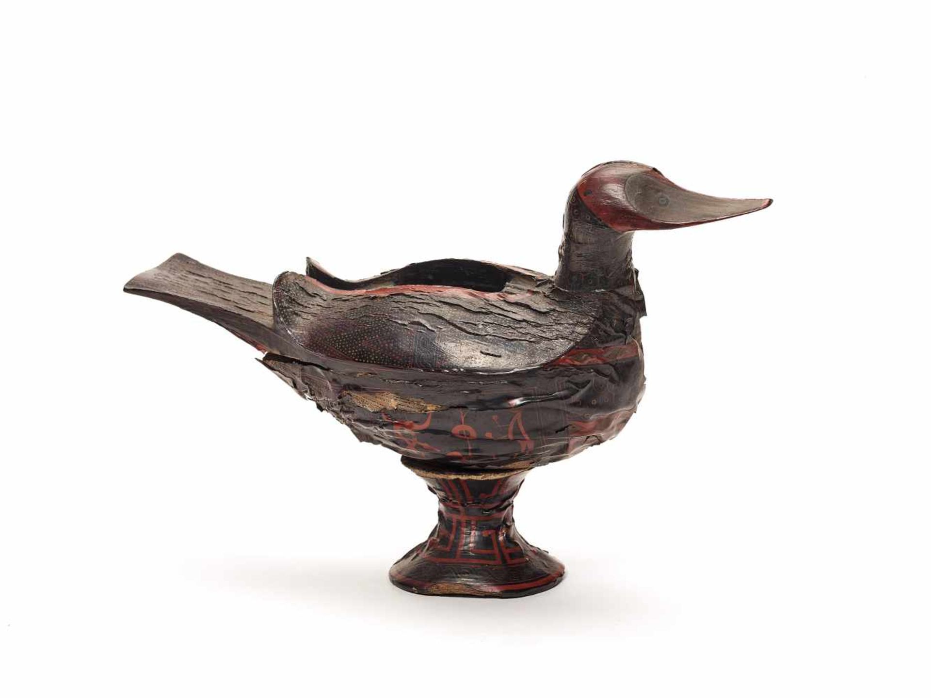 AN EXTREMELY RARE HAN DYNASTY LACQUER DUCK ON MATCHING STANDThe carved wooden bird with original