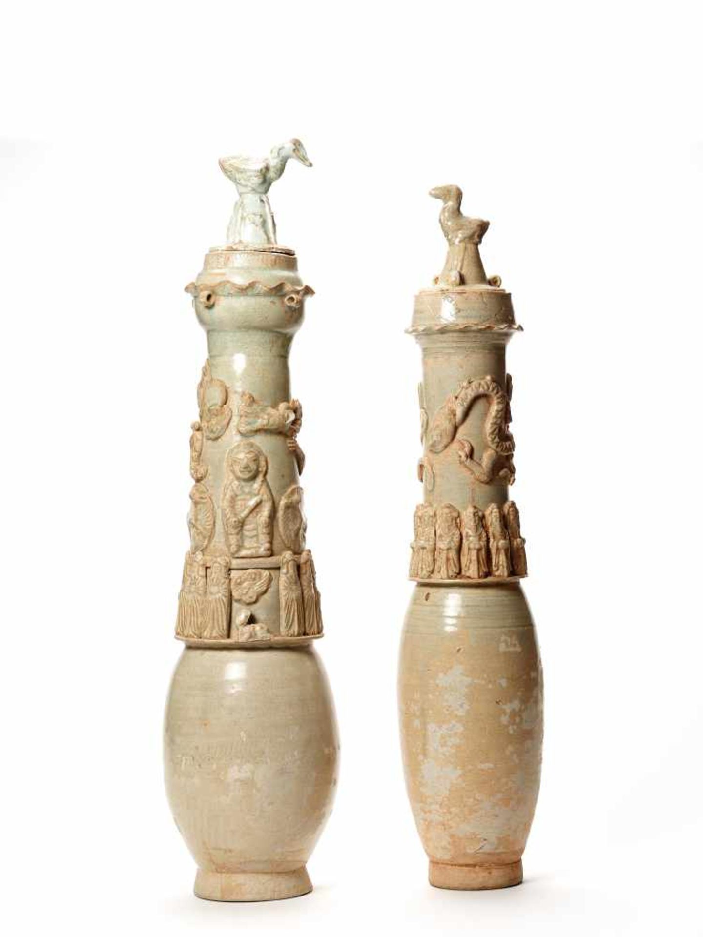 A PAIR OF LARGE CELADON-GLAZED URNS WITH COVERS, SONG DYNASTYBoth vessels with dragons, dignities