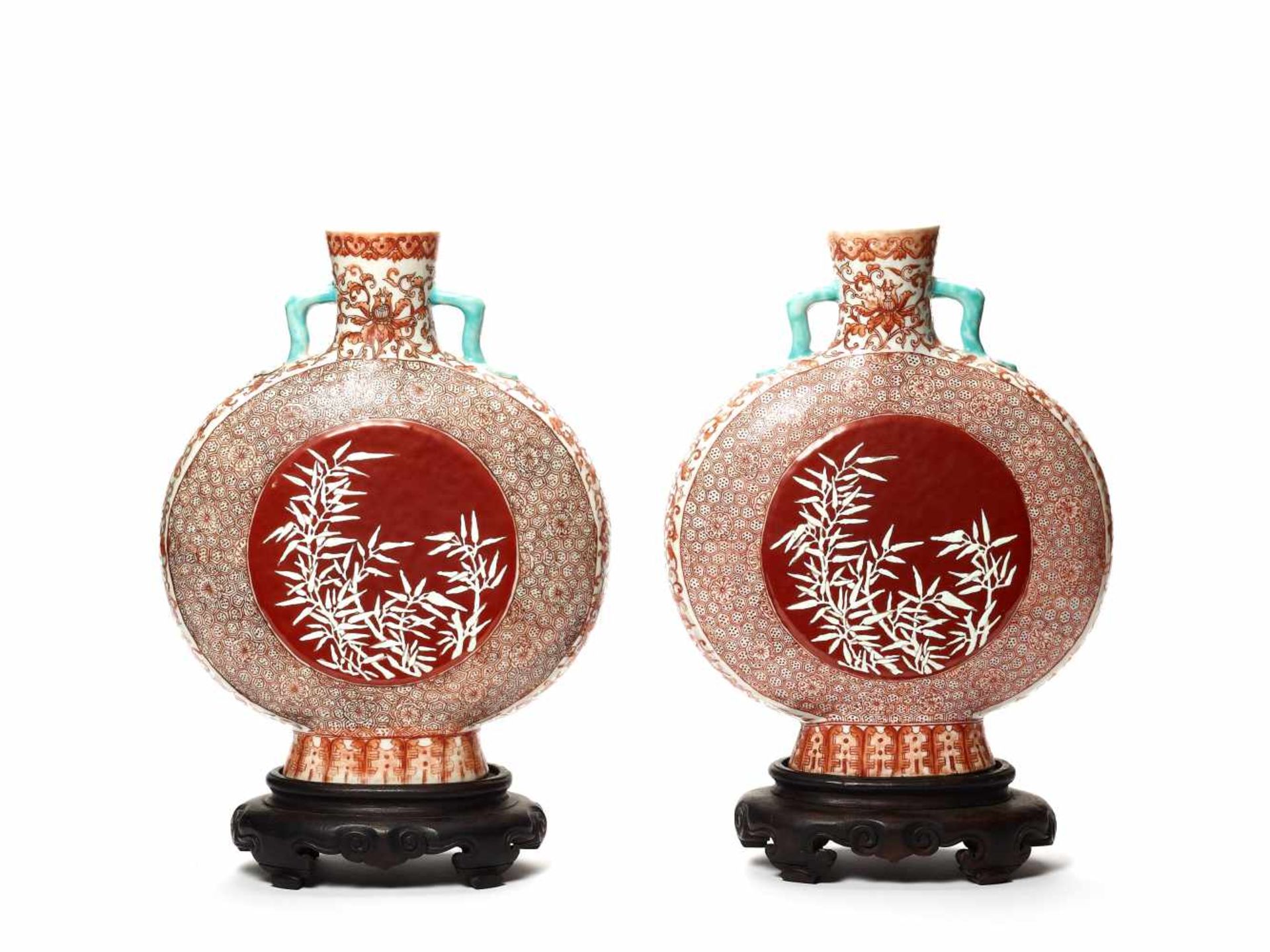 A PAIR OF ‘BAMBOO’ MOONFLASK VASESPainted in iron red above the glaze, the bamboo in white