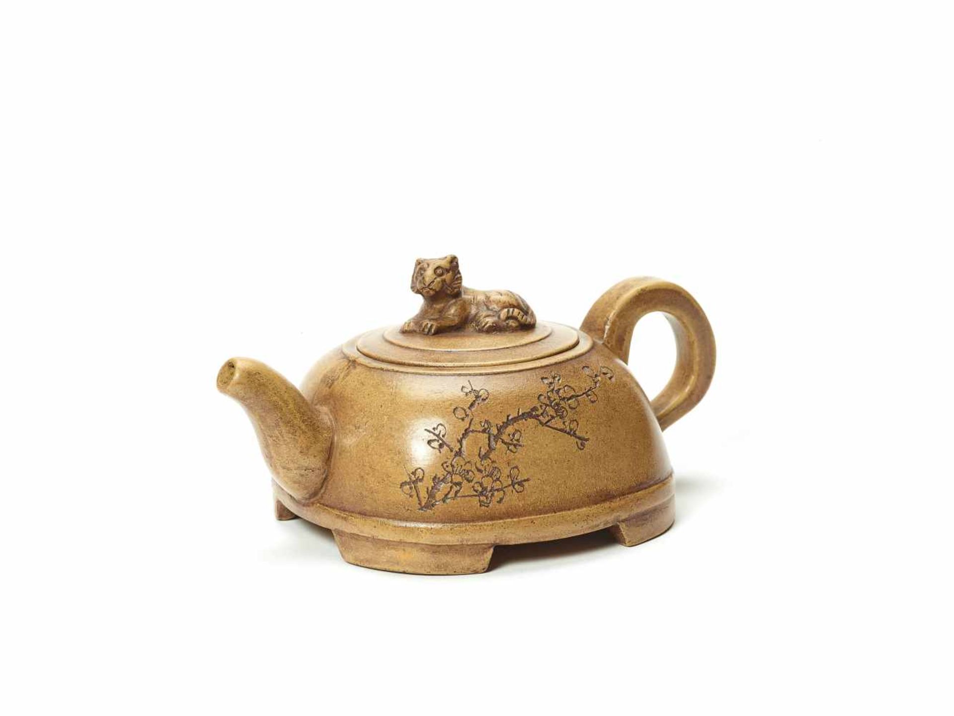 A YIXING CERAMIC ‘PRUNUS’ TEAPOT WITH TIGER FINIALYixing ceramicChina, 20th centuryThe pot with