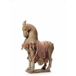 A LARGE AND RARE TERRACOTTA PRANCING HORSE, SUI DYNASTY (581-618)The skillfully modeled statue