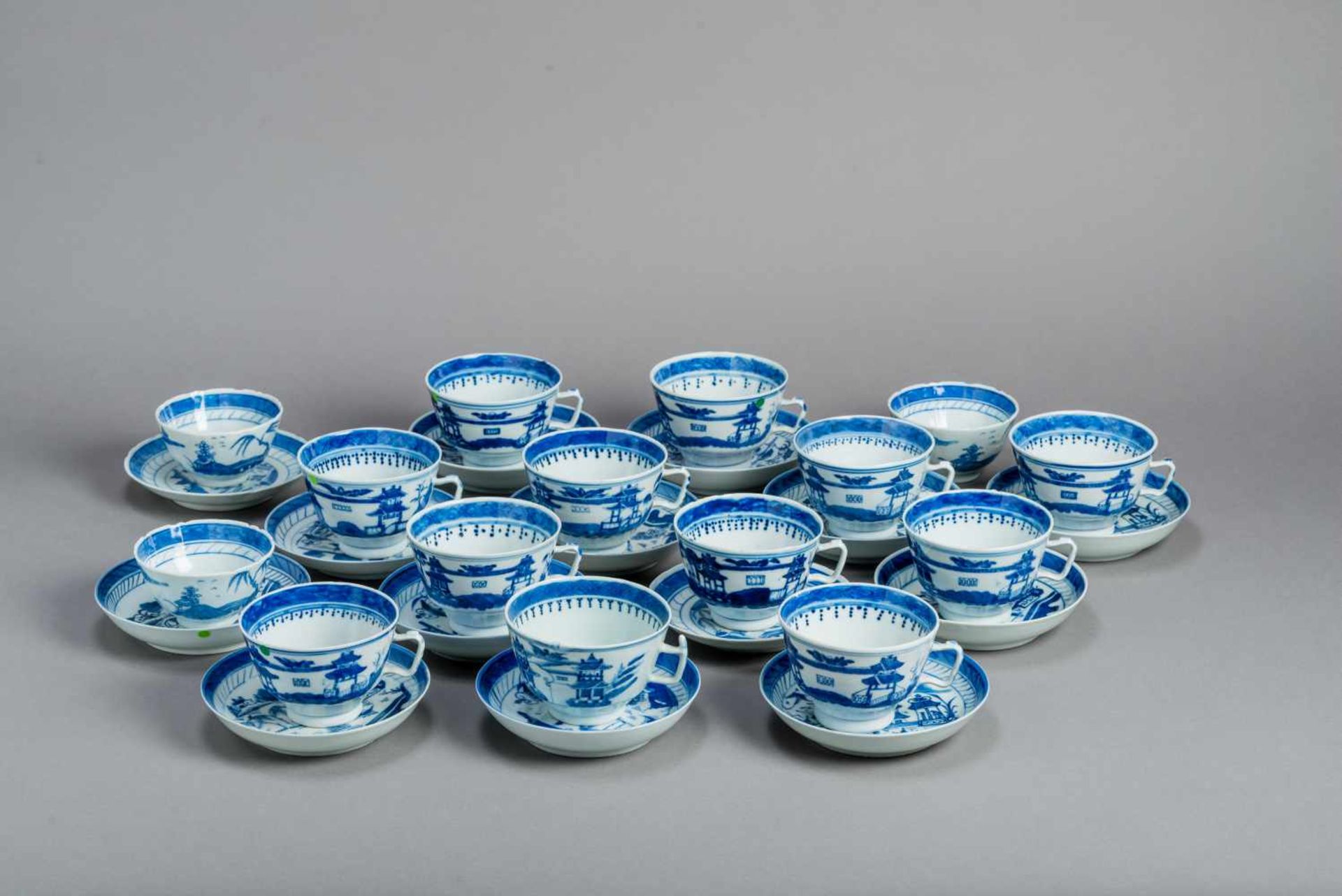 A SET OF 15 BLUE AND WHITE CANTON TEACUPS AND 14 COASTERSBlue and white porcelainChina, Qing dynasty