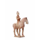 A LARGE TERRACOTTA RIDER ON HORSE, TANG DYNASTY (618-907)The subtly modeled statue with remainders