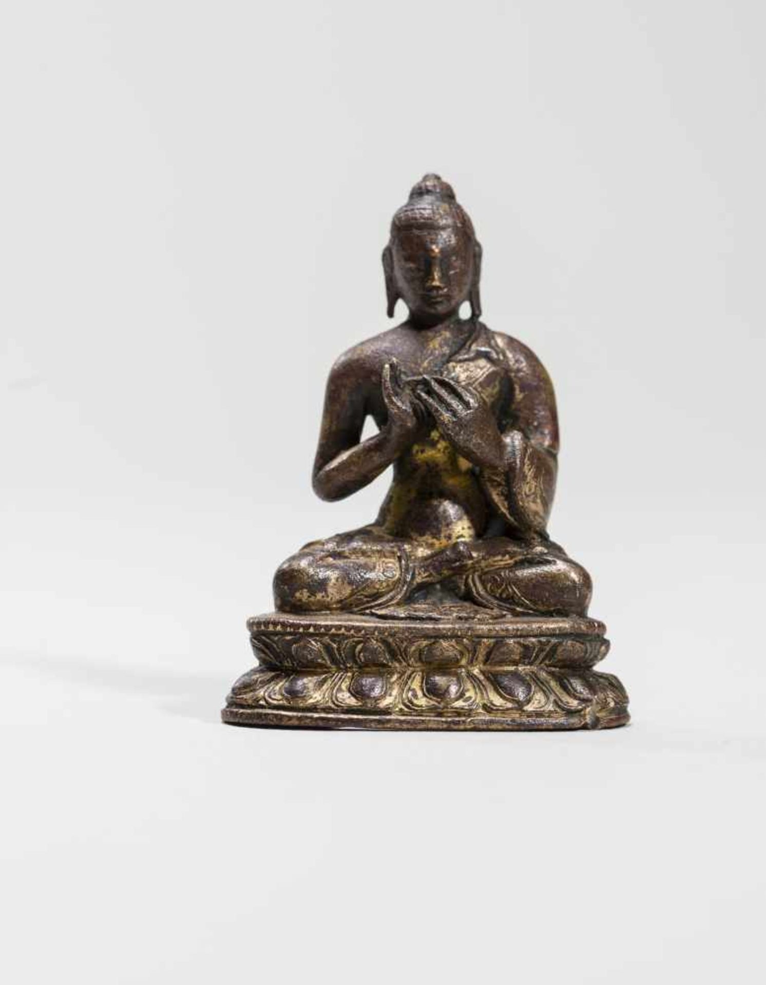 A MINIATURE BRONZE OF BUDDHA SHAKYAMUNI, 18TH-19TH CENTURYBronze with gildingTibet, 18th to 19th