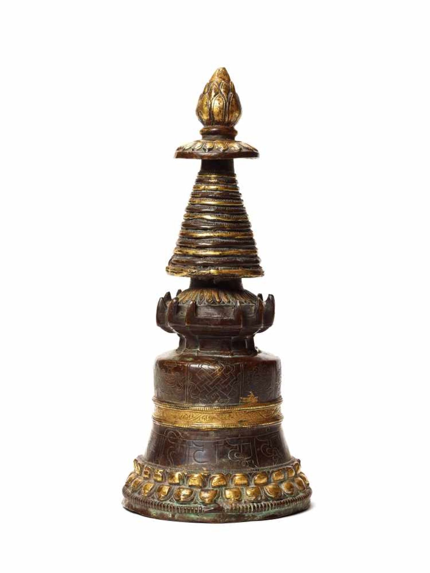 A GILT BRONZE TIBETAN VOTIVE STUPAGilt bronzeTibet, around 1900Of conical form divided into multiple