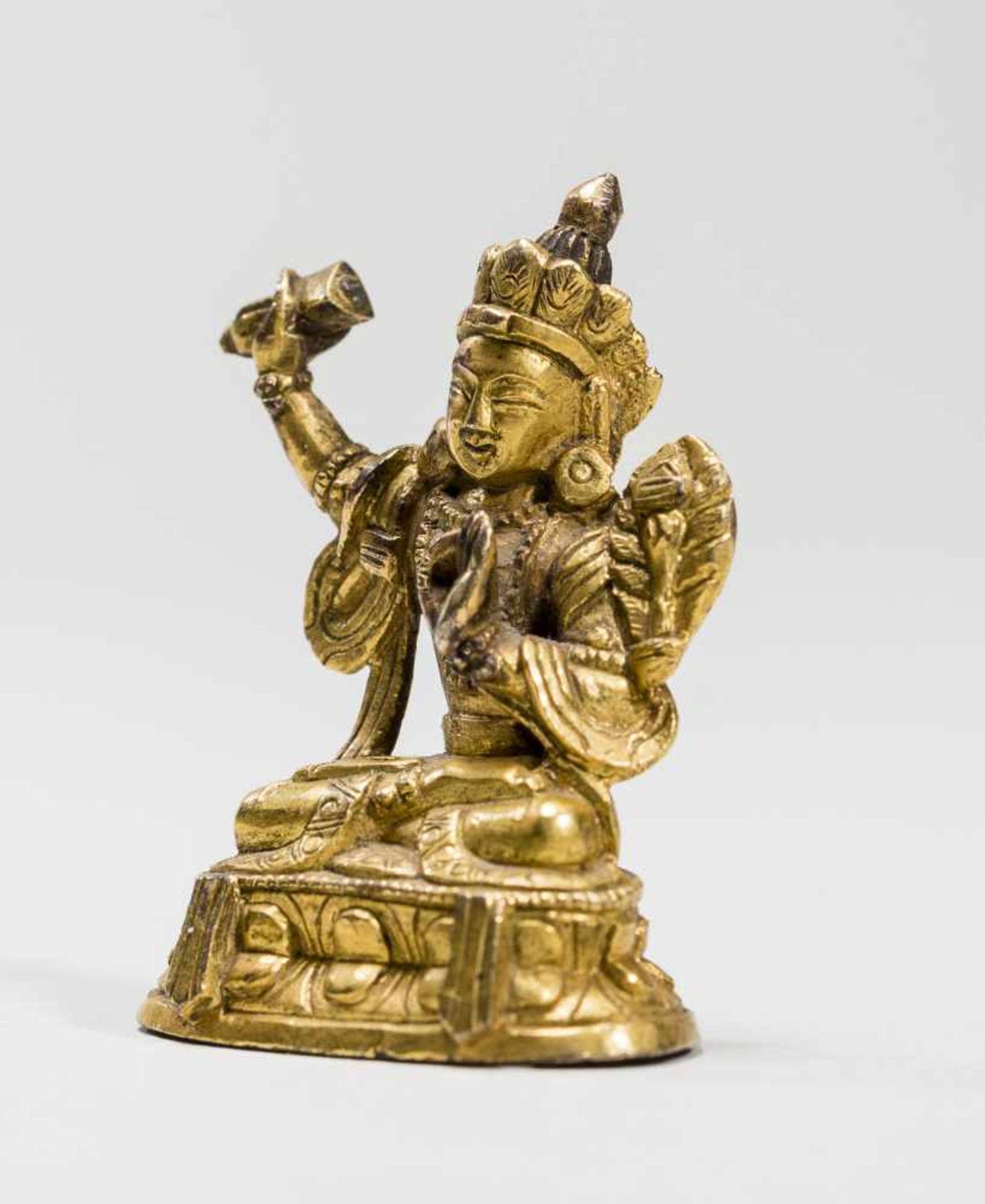 A SINO-TIBETAN FIRE-GILT MINIATURE BRONZE OF MANJUSHRI, 18TH-19TH CENTURYFire-gilt bronzeTibet, 18th - Bild 2 aus 7