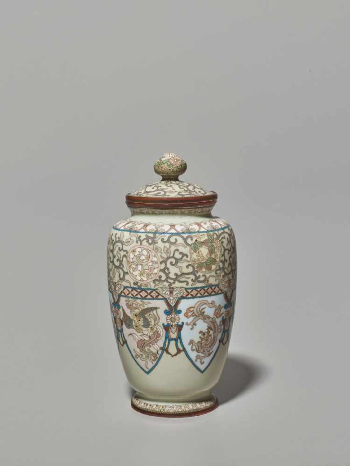 A JAPANESE CLOISONNÉ LIDDED VASE WITH A DESIGN OF PHOENIXES AND DRAGONSCloisonné with colored